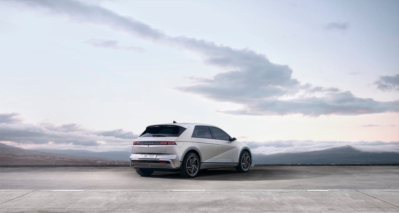 White Hyundai Ioniq 5 on an open road
