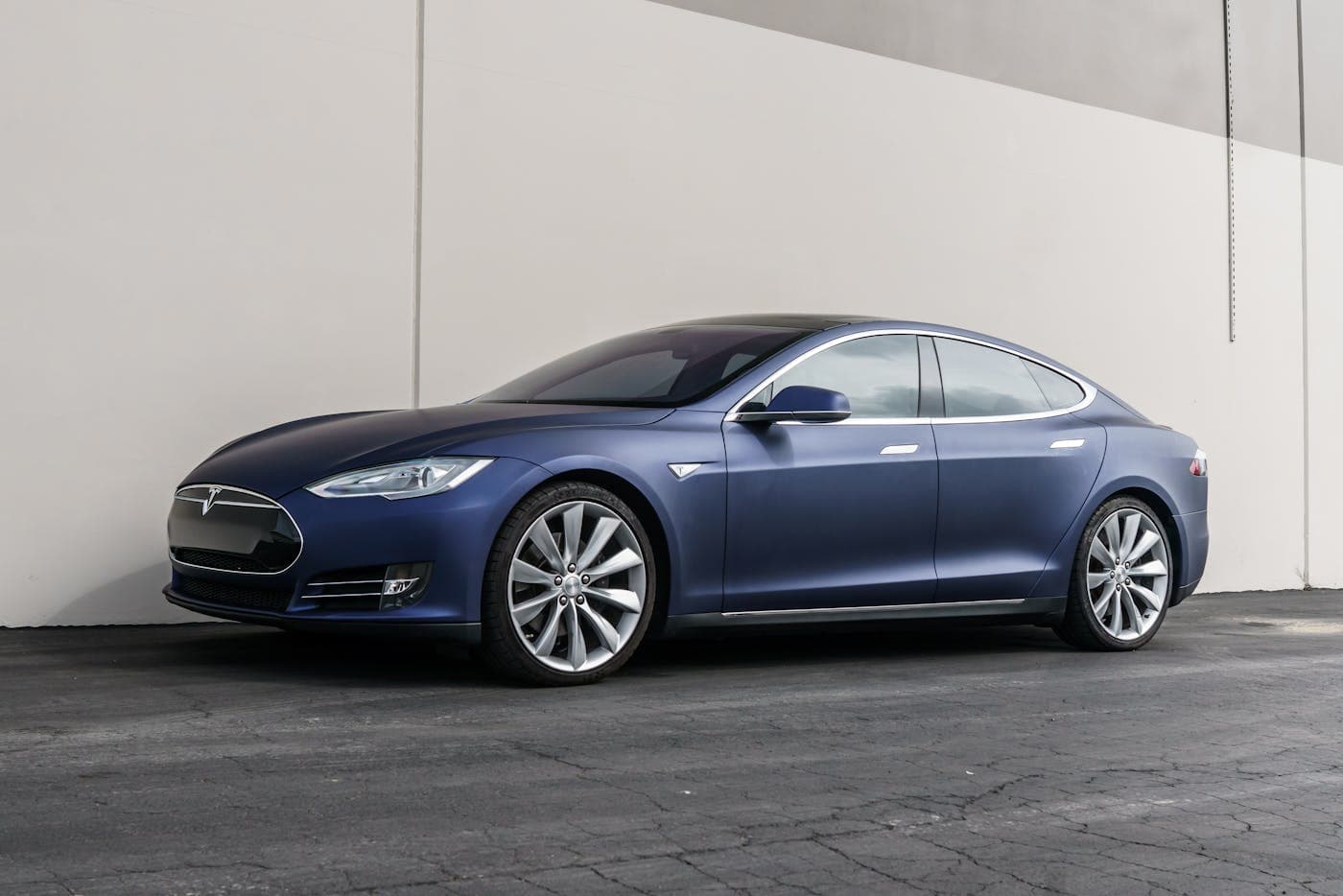 Blue Tesla Model S parked outdoors